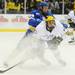 Michigan freshman Andrew Sinelli gets a push from behind from Lake Superior State freshman Kevin Czuczman during the second period at Yost Arena on Friday night. Melanie Maxwell I AnnArbor.com
